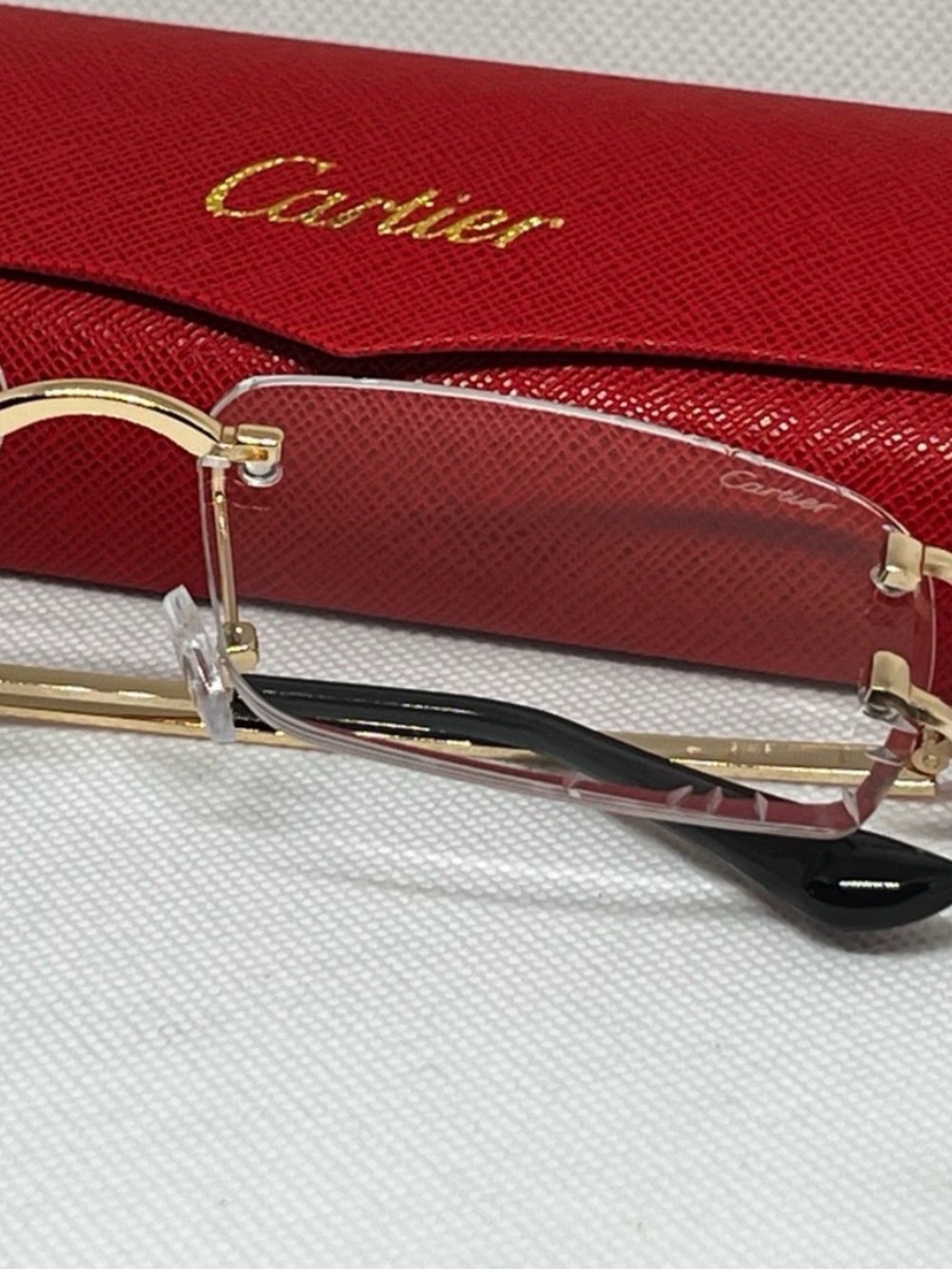 Cartier Rimless Women's Glasses with Gold Frames and Black Temples